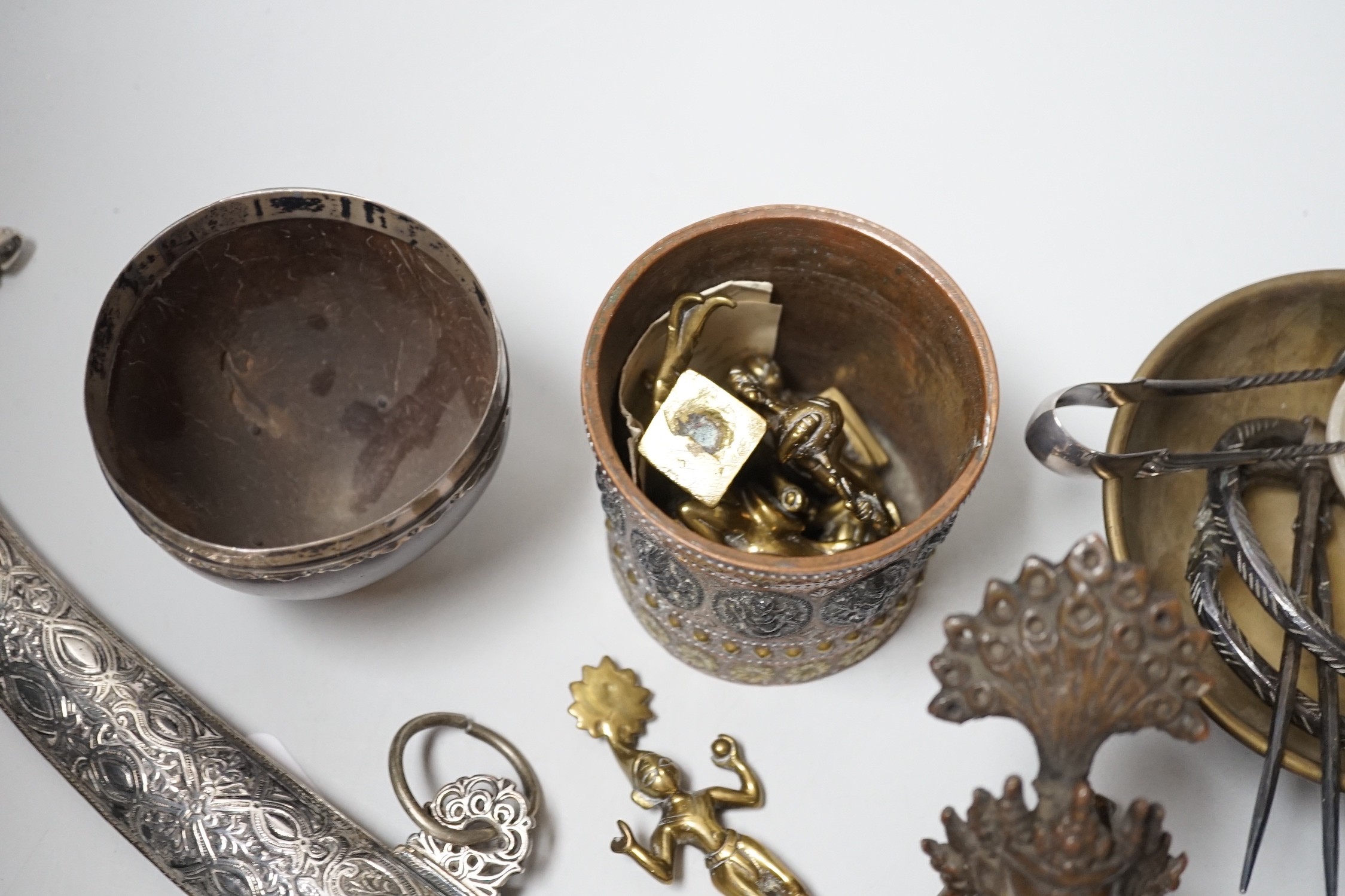 An Eastern white metal mounted dagger, a quantity of Eastern metalware and a white metal-mounted cup